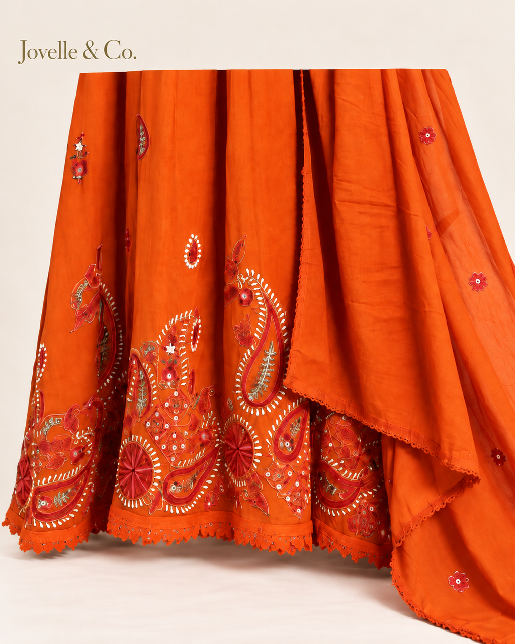 Jovelle & Co. rust orange mul cotton outfit — hem view