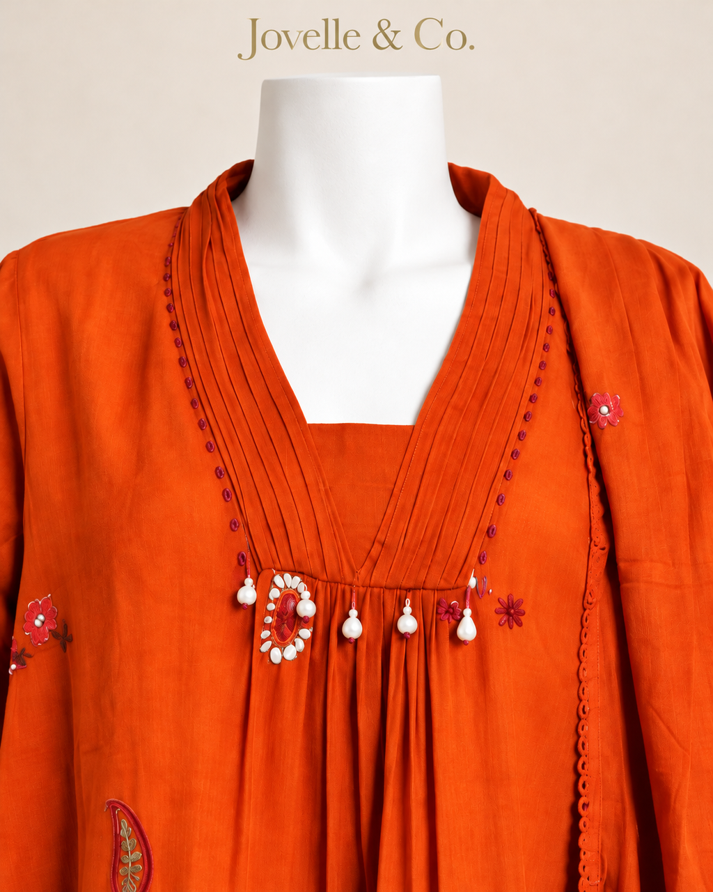 Jovelle & Co. rust orange mul cotton outfit — neckline view